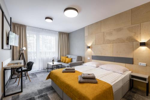 Postel nebo postele na pokoji v ubytování KRISTINA Willa & Spa