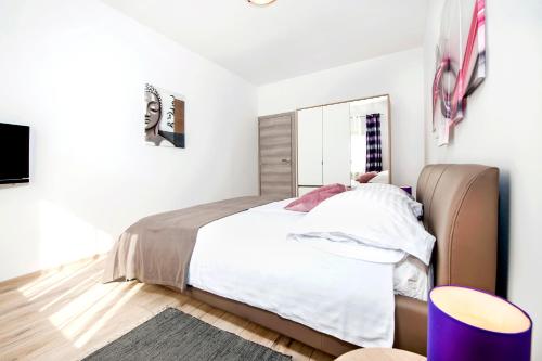 Ένα ή περισσότερα κρεβάτια σε δωμάτιο στο Apartments Euphemia