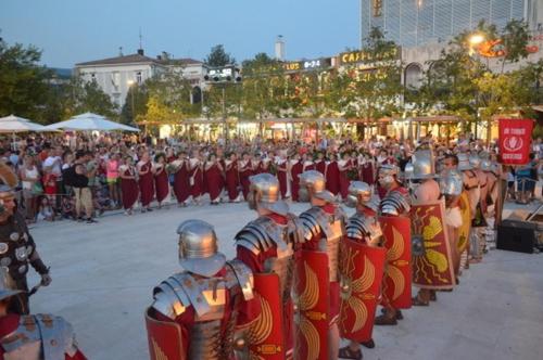 a group of people dressed in armour in front of a crowd at Apartments Adriatic in Selce