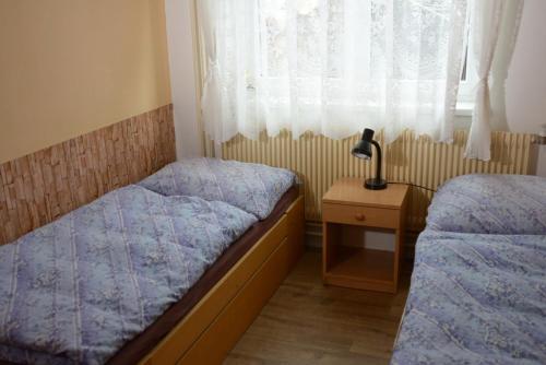 Postel nebo postele na pokoji v ubytování Ubytování U Součků Jindřichův Hradec