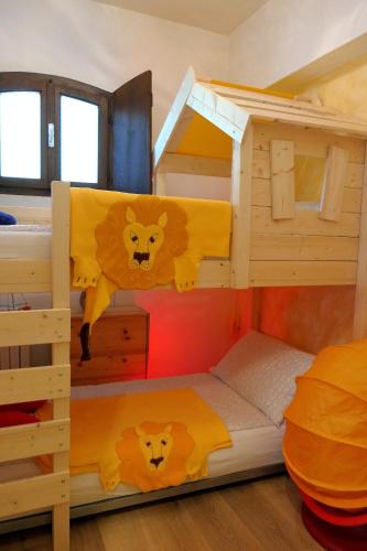 a bunk bed with two bunk beds in a room at Casa Artis in Gravedona