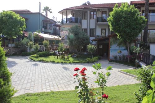 a courtyard of a apartment building with a garden at İberia Villas in Ortaca