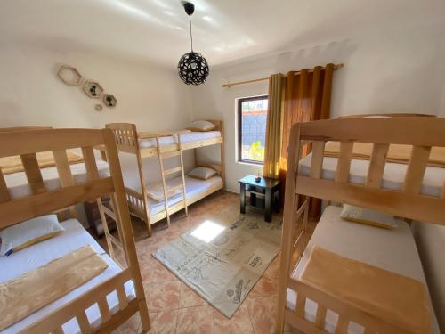 Una cama o camas en una habitación de The Hood - Shkodra Backpackers Hostel & Day Tours