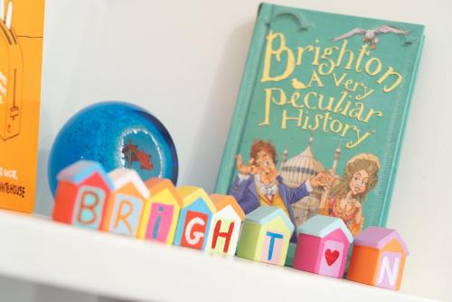 a book sitting on a shelf next to a toy fence at The Studio @ 93 Bernard Rd in Brighton & Hove