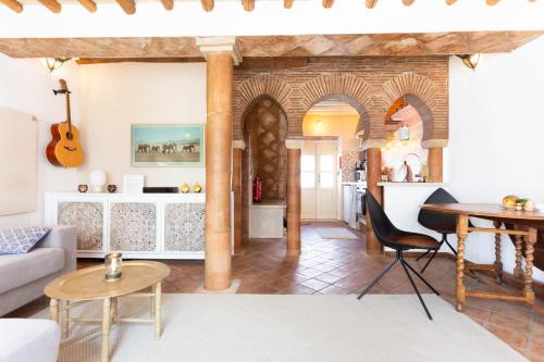 a living room with a couch and a table at Beachhouse Algarve, Beach 50m in Salema