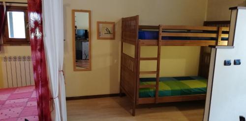 a room with two bunk beds and a mirror at B&B Caselunghe in Camerino