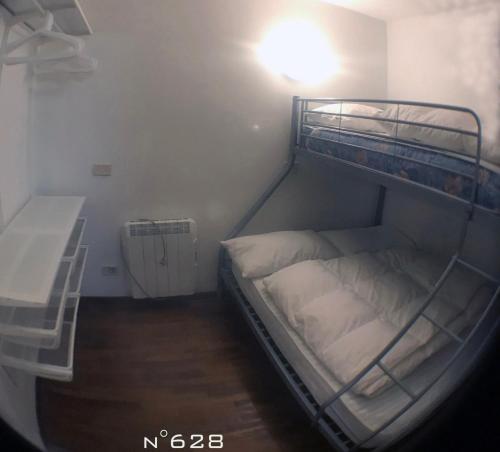 Postel nebo postele na pokoji v ubytování House Cervinia Apartments