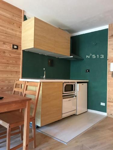 Kuchyň nebo kuchyňský kout v ubytování House Cervinia Apartments