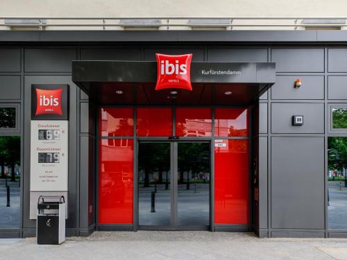 a store front with red doors and a sign on it at ibis Berlin Kurfuerstendamm - neu renoviert in Berlin
