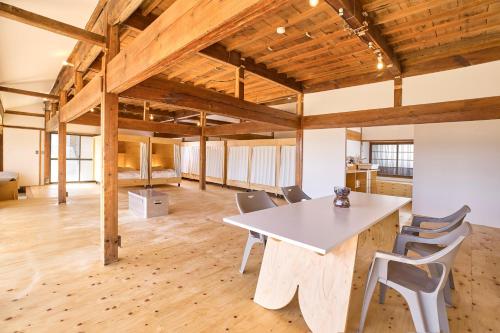 a large room with a table and chairs at HIKE in Nirasaki