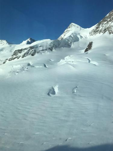 a snow covered mountain with a lot of snow on it at Chalet Burglauenen Grindelwald in Grindelwald