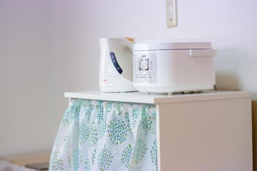 a counter with a coffee maker and a toaster on it at Minamitsuru-gun - House - Vacation STAY 82283 in Fujikawaguchiko