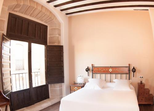Ένα ή περισσότερα κρεβάτια σε δωμάτιο στο Teatrisso Hotel Palacio