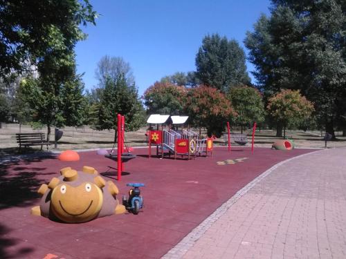 a park with a playground with a toy on the ground at Apartment Spacious Liman in Novi Sad
