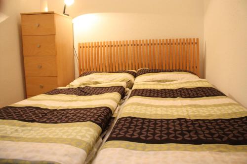 Een bed of bedden in een kamer bij Homelike City Apartment