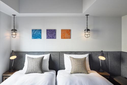Postel nebo postele na pokoji v ubytování Hotel Resol Akihabara