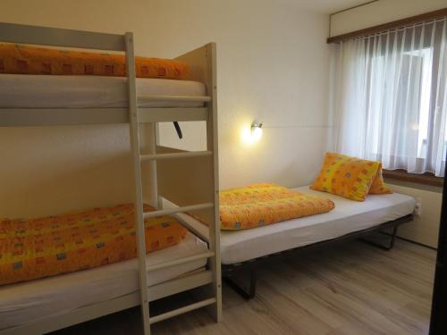 Un pat sau paturi într-o cameră la Hof Arosa