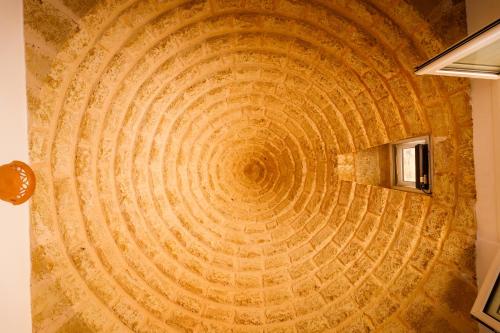 マリーナ・ディ・ペスコルーゼにあるCallistos Trullo Torre Vadoのギャラリーの写真