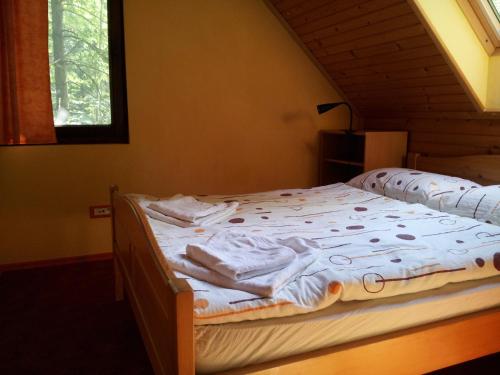 A bed or beds in a room at Apartments Lake Bohinj