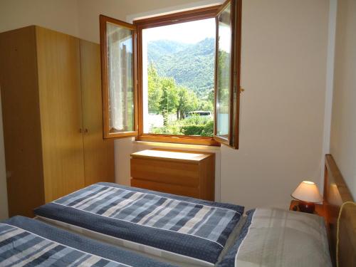 A bed or beds in a room at Villa Soghetta Typ S3