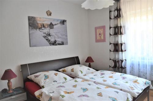 Ένα ή περισσότερα κρεβάτια σε δωμάτιο στο Ferienwohnung Klock