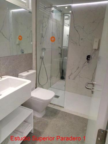 a bathroom with a shower and a toilet and a sink at Paraiso del Sol y Paradero in Playa de las Americas