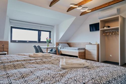 Postel nebo postele na pokoji v ubytování Penzion Fialka