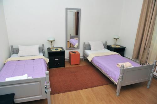 A bed or beds in a room at Bulevar