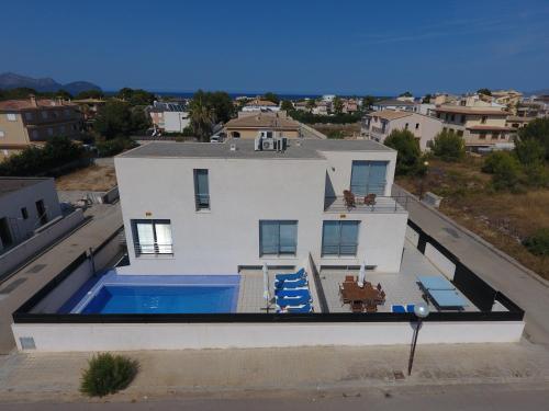 an aerial view of a house with a swimming pool at PICAFORT2 in Can Picafort