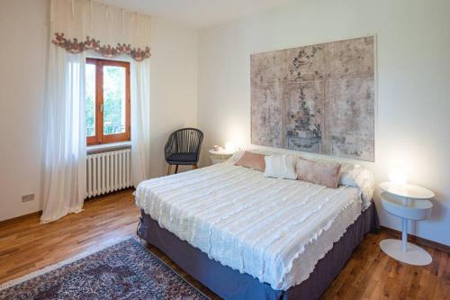 Postel nebo postele na pokoji v ubytování Villa Monte Illuminato