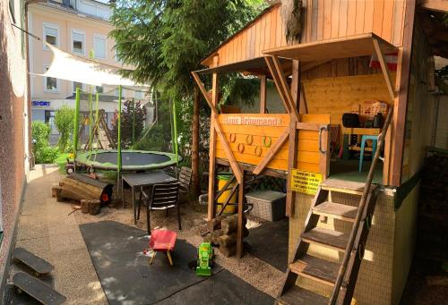 a play house with a bunk bed and a table at Apartment Haus Braumandl in Bad Ischl