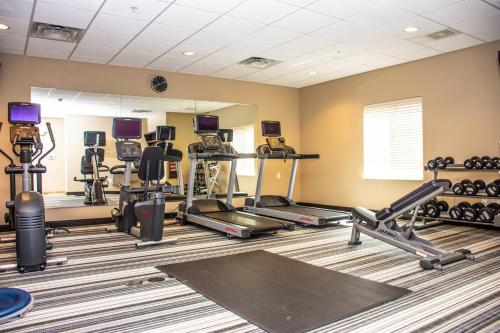 a gym with several treadmills and cardio machines at Candlewood Suites Overland Park W 135th St by IHG in Overland Park