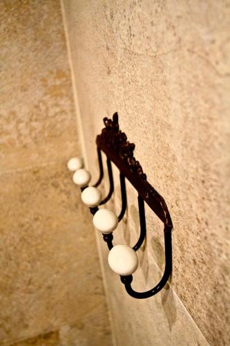 a chandelier on the wall of a building at Vila Terrasse in Košice