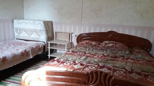 Postel nebo postele na pokoji v ubytování Dacha v Arkadii