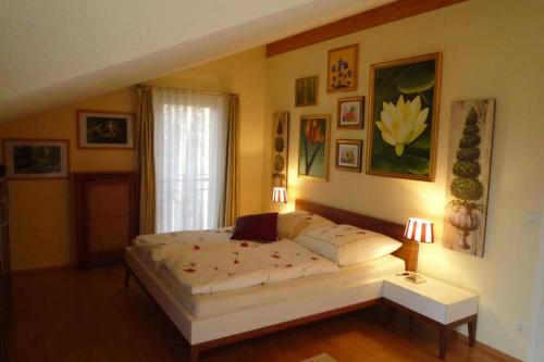 a bedroom with a large bed and a window at Gästehaus im Park in Berlin