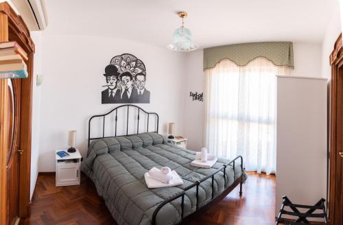 Ein Bett oder Betten in einem Zimmer der Unterkunft L'Attico Fuggente