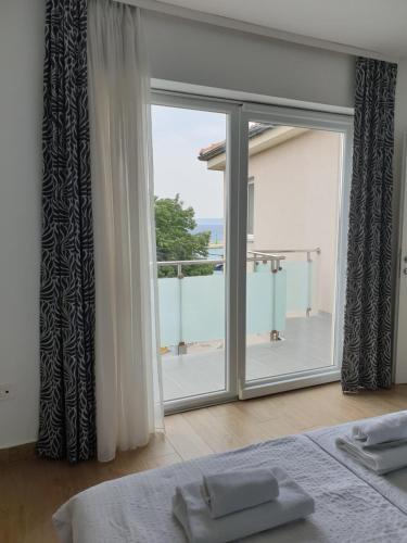 En eller flere senge i et værelse på Apartments Ivančić 2