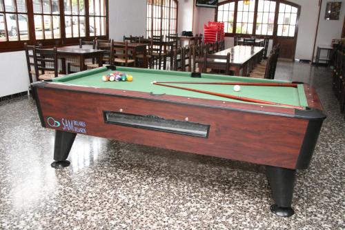 a pool table sitting inside of a room with ahibition at Raco d'en Pepe in Calella