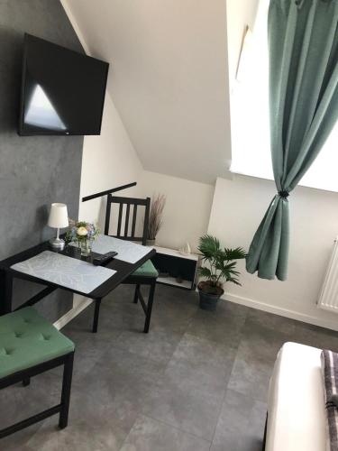 a dining room with a table and a window at Schulz Apartments in Bonn