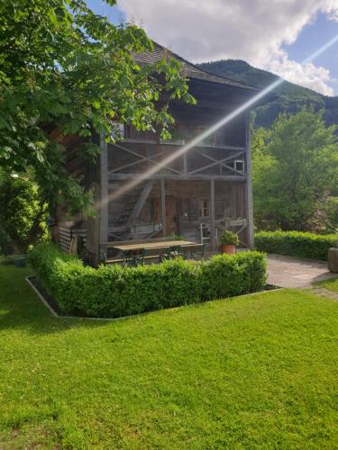 a house with a picnic table in a yard at Attwengerhof in Traunkirchen