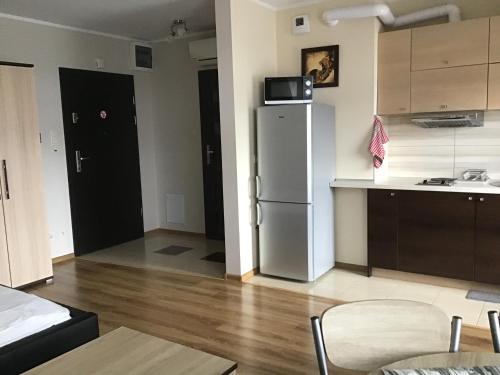Η κουζίνα ή μικρή κουζίνα στο Młynowa - Apartamenty Centrum New