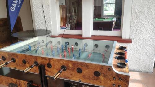 a room with a pool table with a bunch of microphones at South Rakaia Hotel in South Rakaia