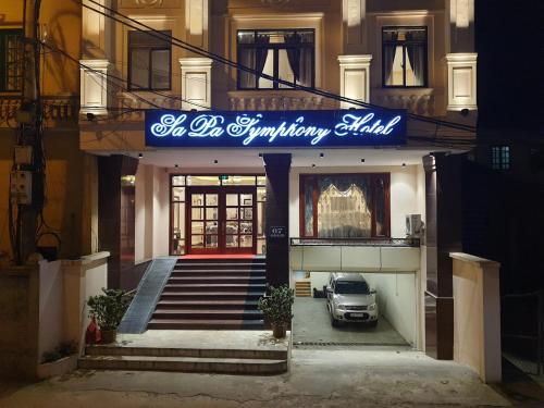 a car parked in front of a building at Sapa Symphony Hotel in Sa Pa