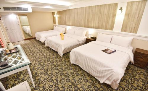 Postel nebo postele na pokoji v ubytování Migo Hotel