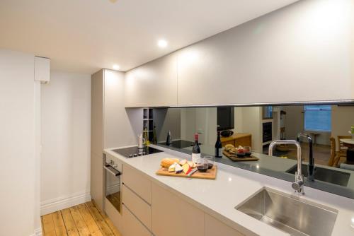 a kitchen with a sink and a counter top at Beachside Loft St Kilda west in Melbourne