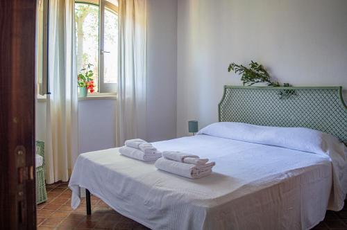 Posteľ alebo postele v izbe v ubytovaní Tenuta San Calogero Appartamento Salvia
