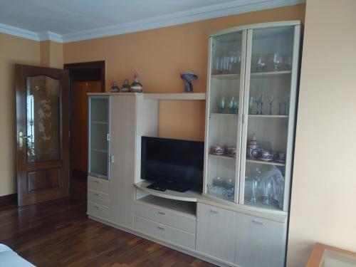 a large white cabinet with a television in it at Apartamento Trapagaran in Trapagaran