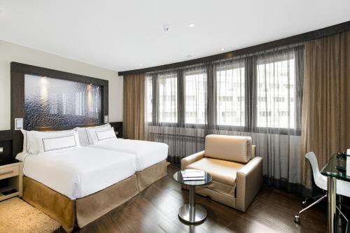 Ένα ή περισσότερα κρεβάτια σε δωμάτιο στο Meliá Sol y Nieve