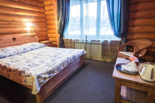 Кровать или кровати в номере Гостиничный комплекс Коровницкая Слобода