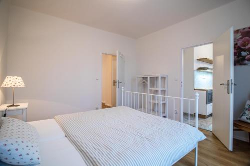 Postel nebo postele na pokoji v ubytování apartmán v bytovém domě Turnov